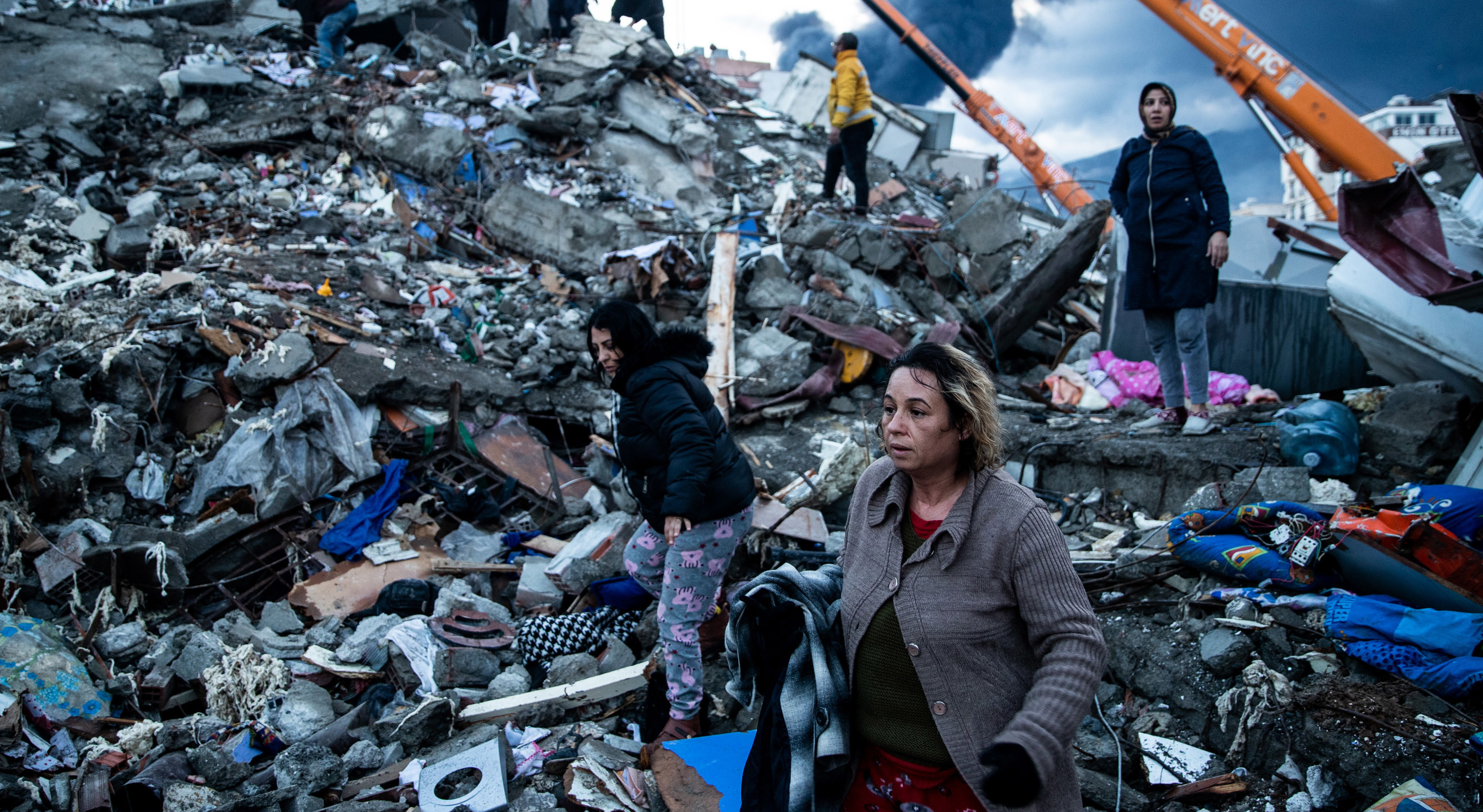 Earthquake survivors wait for news of their loved ones, believed to be trapped under collapsed building  in Iskenderun, Turkey. 