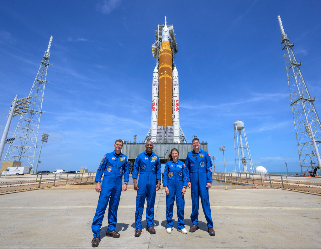 NASA astronauts Reid Wiseman, Artemis II commander, from left, Victor Glover, Artemis II pilot, Christina Koch, Artemis II mission specialist, and CSA (Canadian Space Agency) astronaut Jeremy Hansen, Artemis II mission specialist, right, in a group photograph