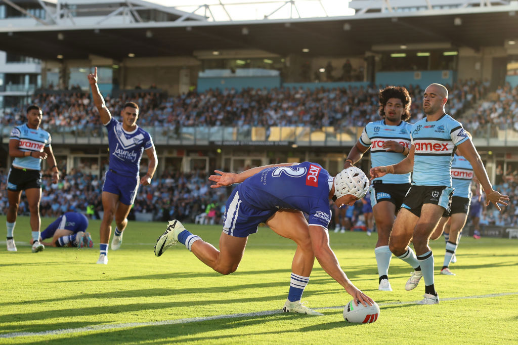 Blake Wilson of the Bulldogs scores a try.