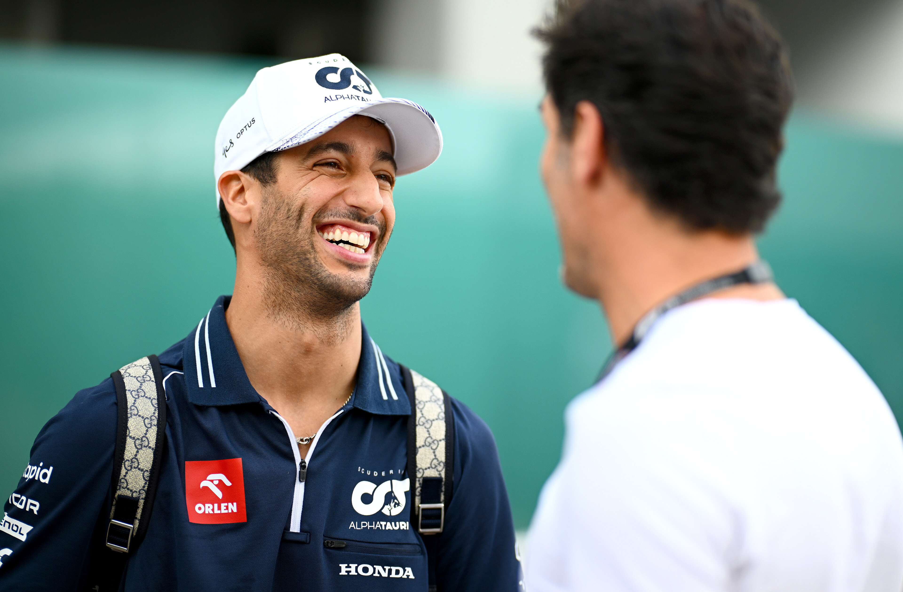 Daniel Ricciardo of Australia and AlphaTauri talks to Mark Webber in the paddock at the Singapore Grand Prix.
