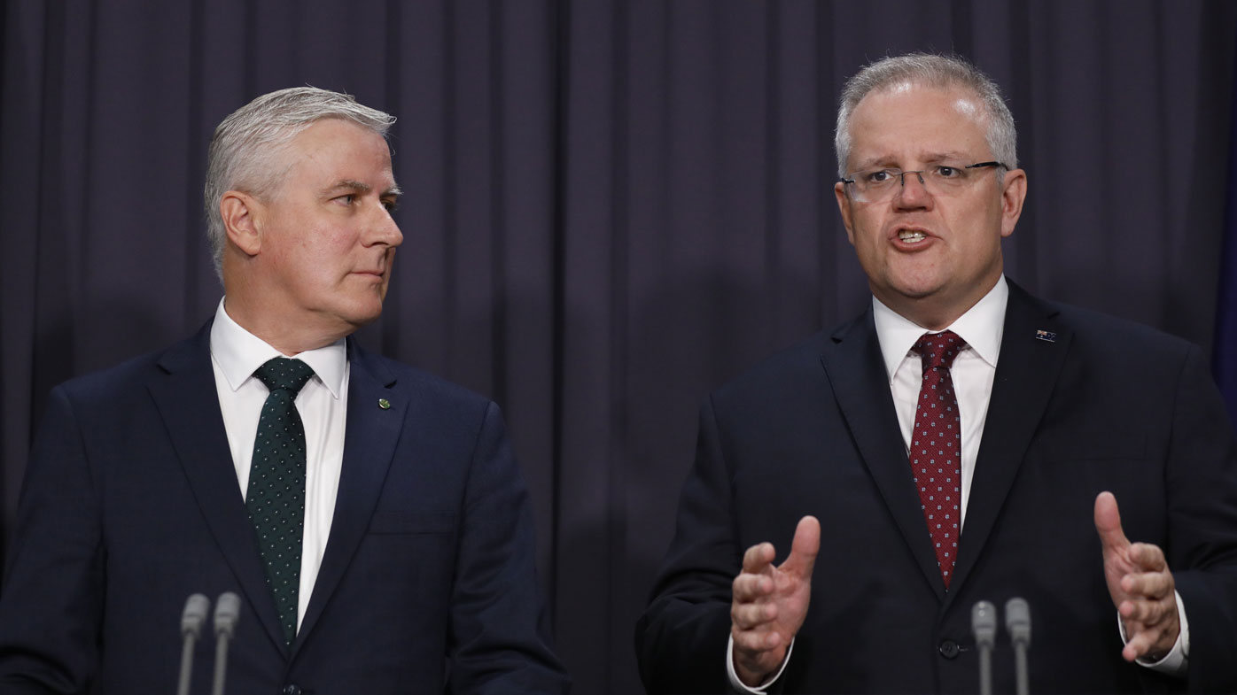 Prime Minister Scott Morrison and Deputy Prime Minister Michael McCormack speak to the media about a ministerial reshuffle at Parliament House in Canberra.