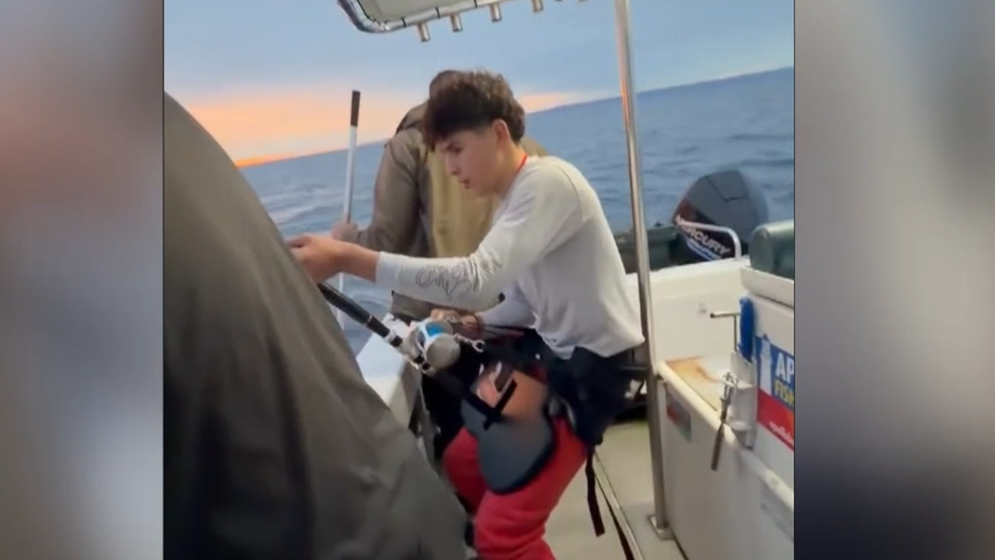 The four spent two hours wrangling the massive fish.