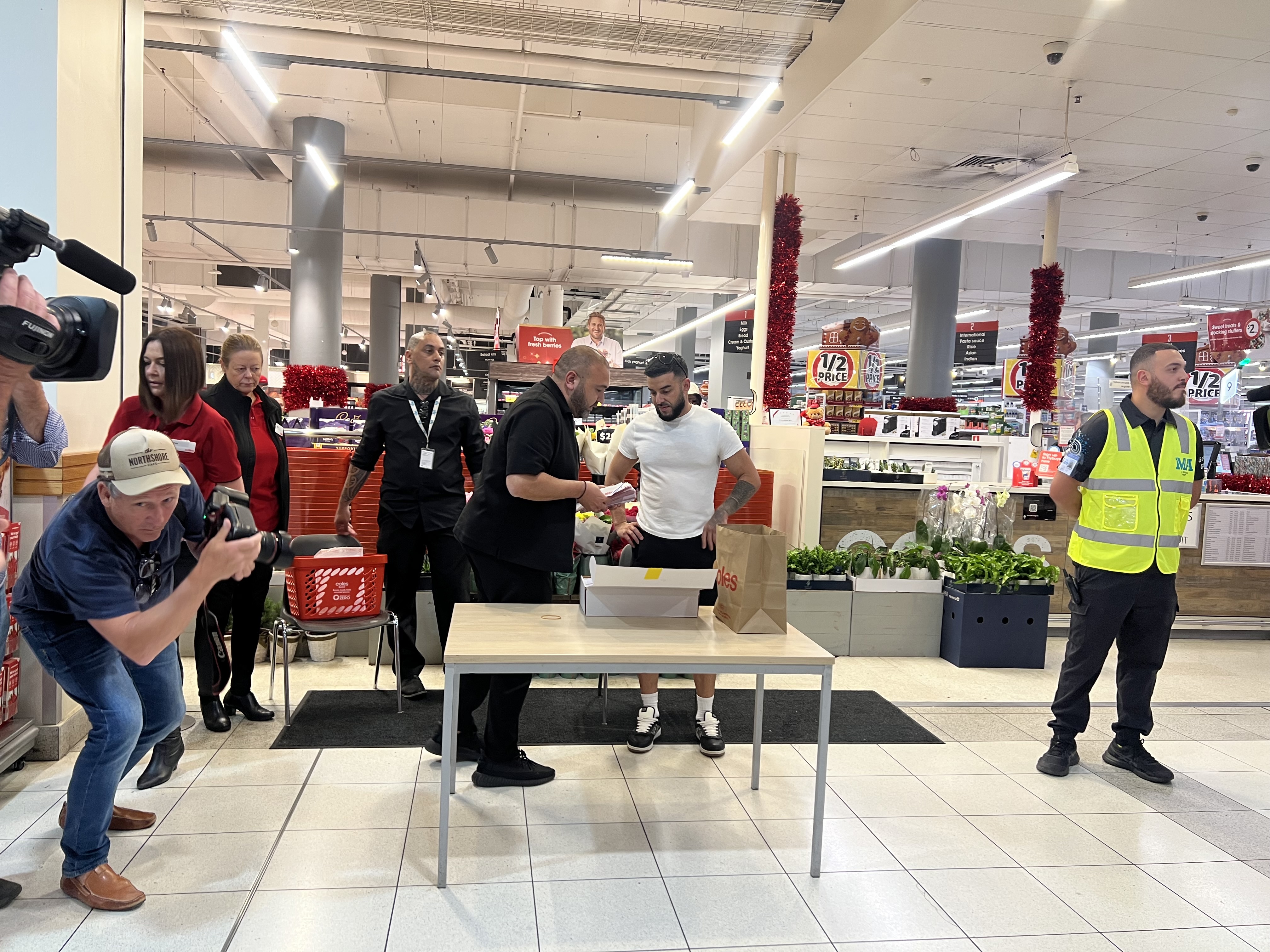 Australians have been lining up all morning to get a slice of billionaire Adrian Portelli's $150,000 giveaway, with the lucky ones planning to use the money to alleviate cost of living pressures.
