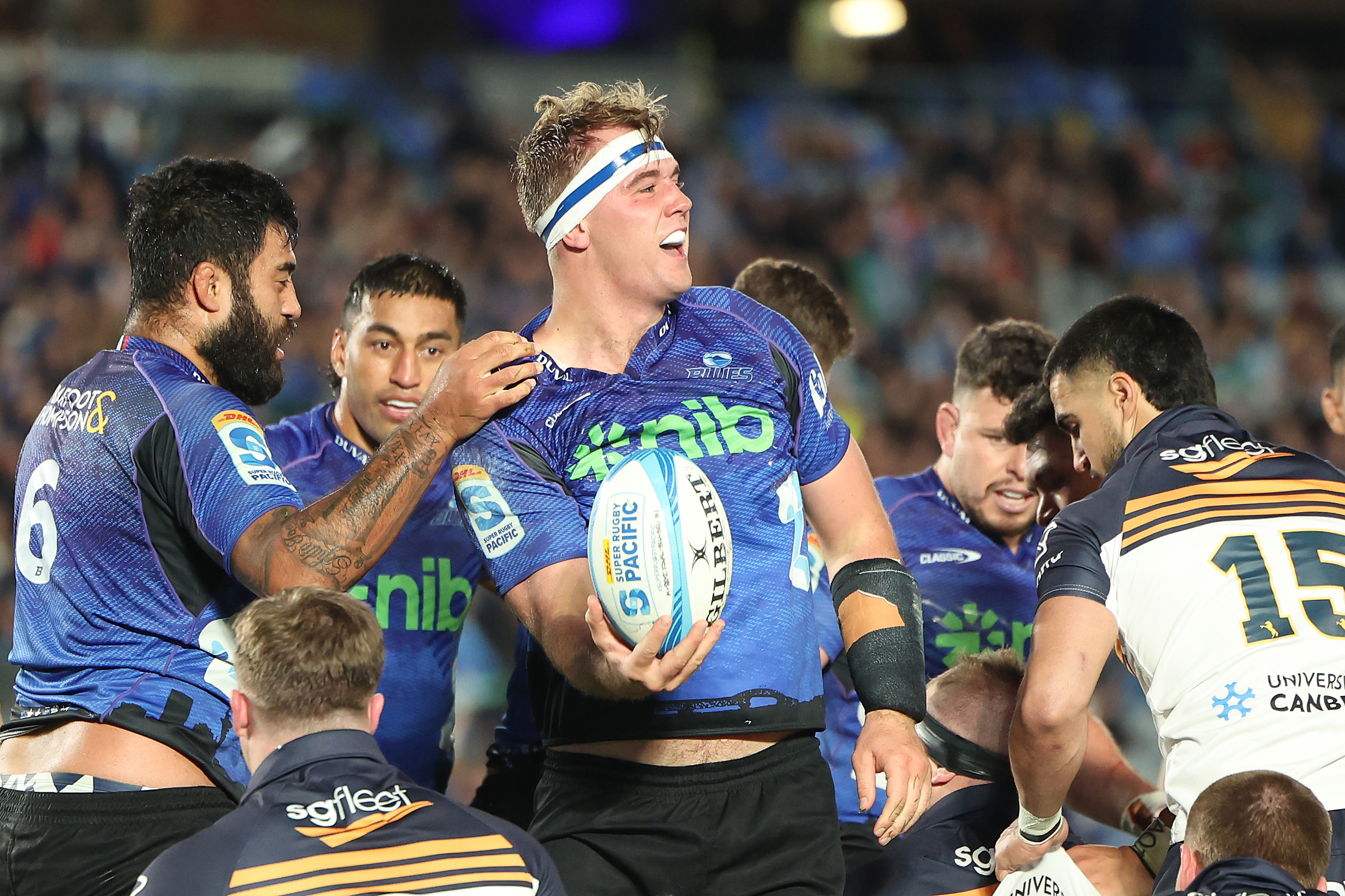 Sam Darry of the Blues celebrates his try.