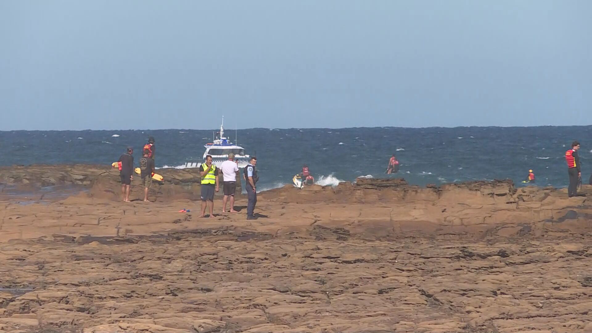A desperate search is under way for a 15-year-old boy believed to have been swept off rocks on the NSW Central Coast