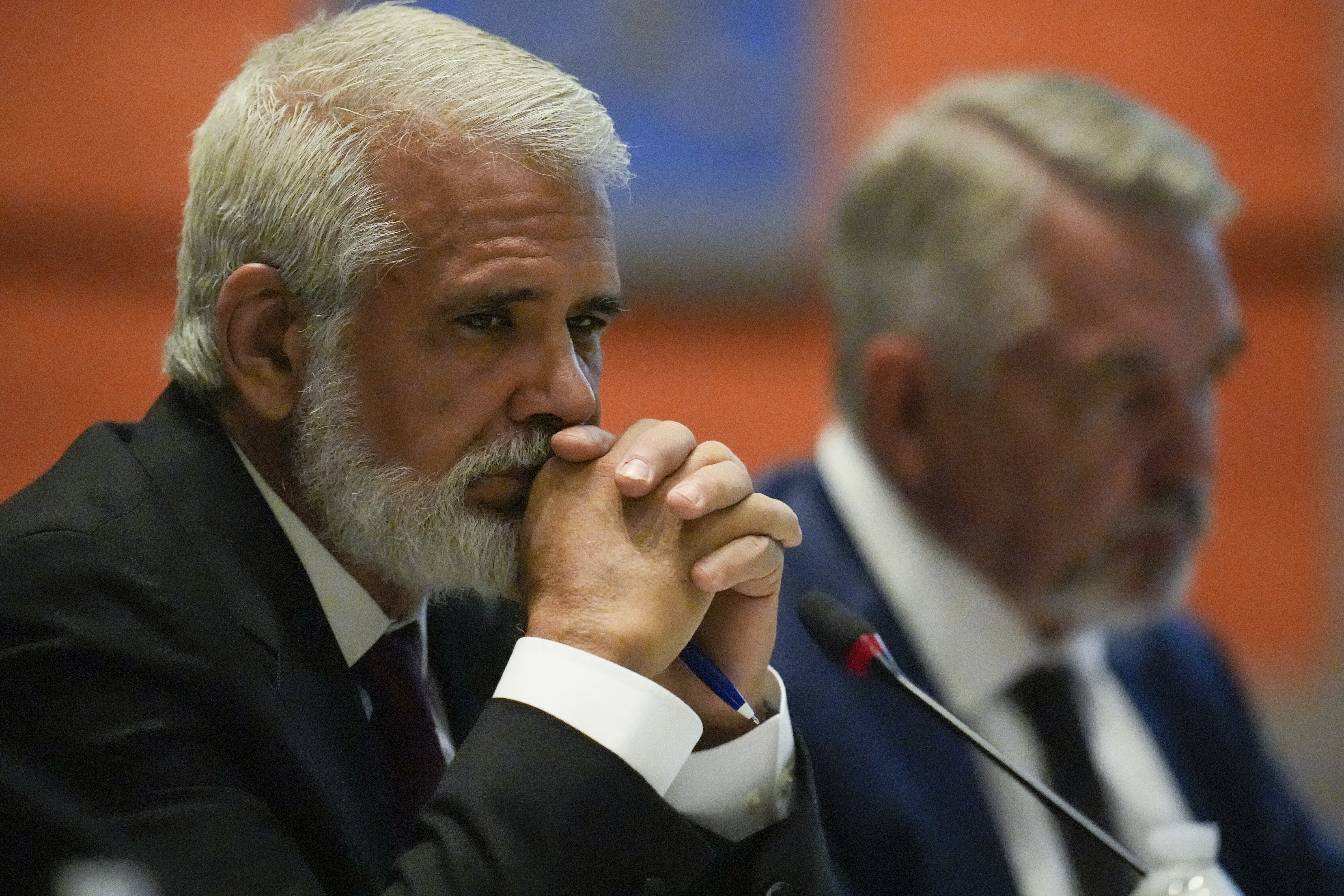Dr. Robert Malone, left, listens during a meeting of the Advisory Committee in Immunization Practices at the CDC, Wednesday, June 25, 2025, in Atlanta. 
