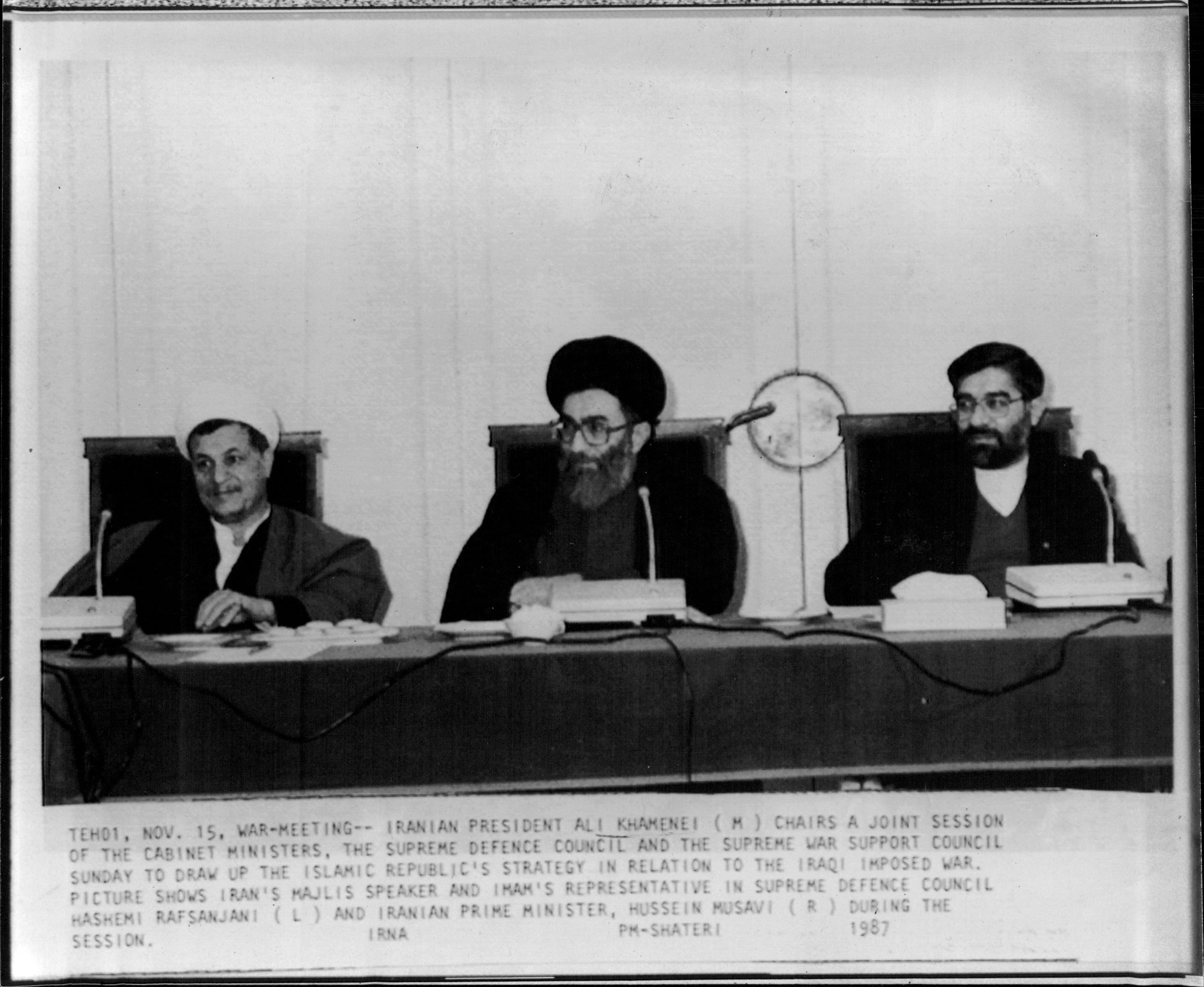 Iran's Majli's speaker and Imam's representative in supreme defence council Hashemi Rafsanjani (L) and Iranian Prime Minister, Hussein Musavi (R) during the session. War-Meeting.  Iranian President Ali Khamenei (M) Chairs a joint session of the cabinet minister. The supreme defence council and the supreme war support council Sunday to draw up the Islamic republic's strategy in relation to the Iraqi imposed war. November 15, 1987.
