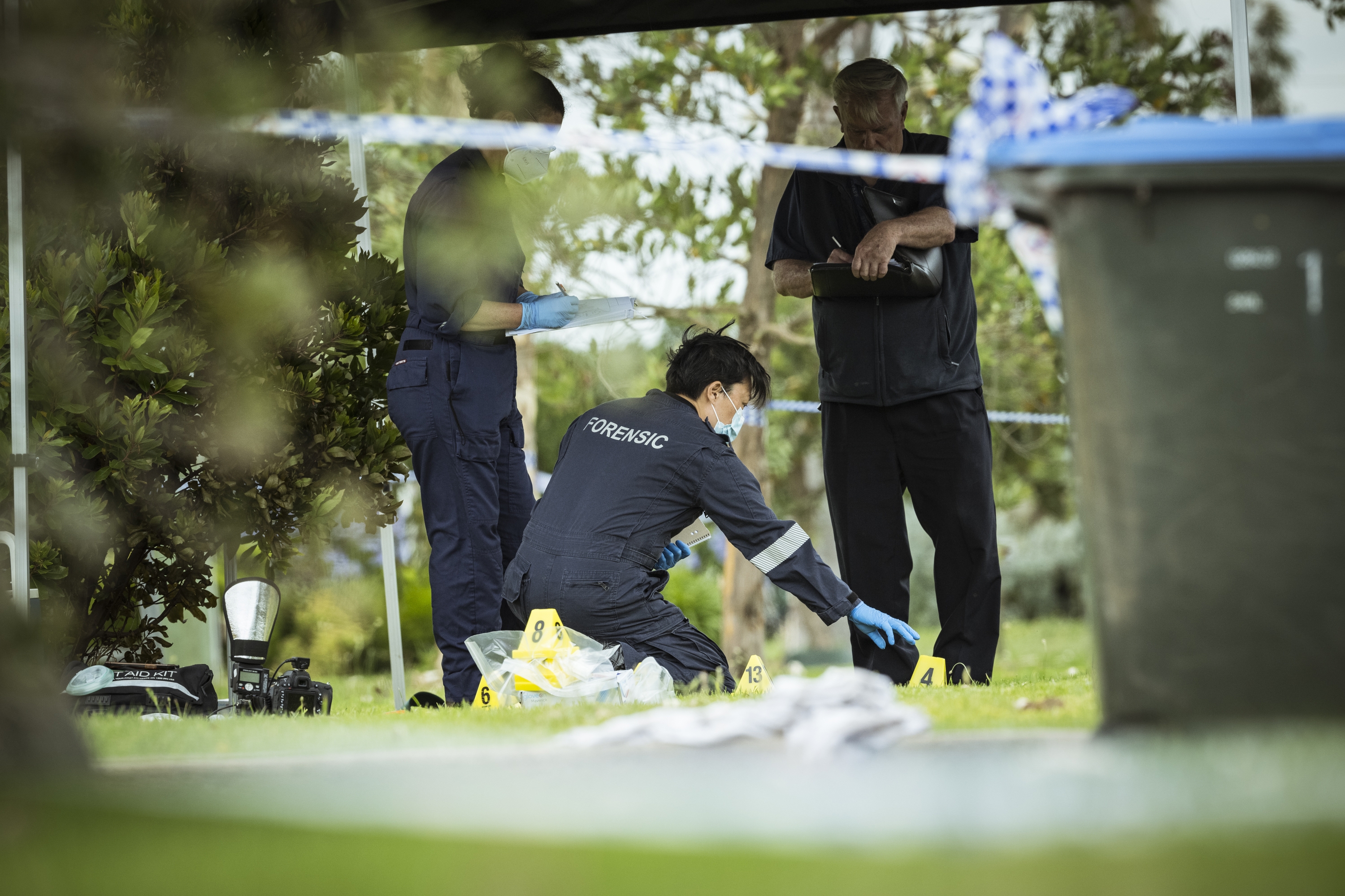 Forensic police investigate at the scene in Werribee South where the dispute took place.