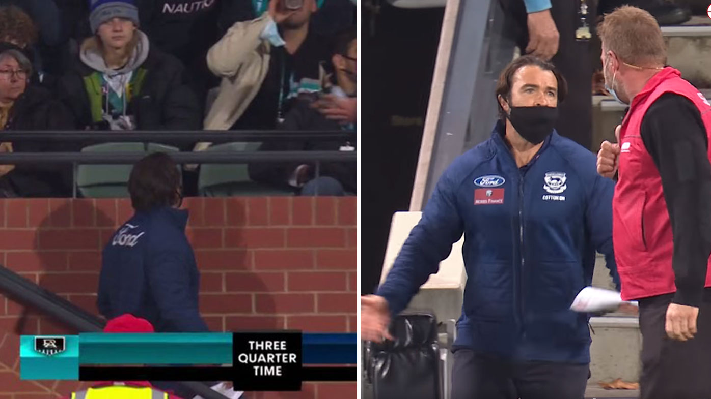 Chris Scott appears to exchange words with a fan