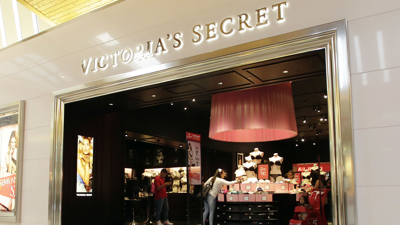 FILE - In this June 7, 2017 file photo, shoppers look at merchandise at a Victoria's Secret store in Hialeah, Fla. Shares of the owner of Victoria's Secret are tumbling, Thursday, Feb. 20, 2020, as media reports continue to say that the struggling brand is going to being sold soon. The Wall Street Journal is reporting L Brands Inc. is close to selling Victoria's Secret for about $1.1 billion.