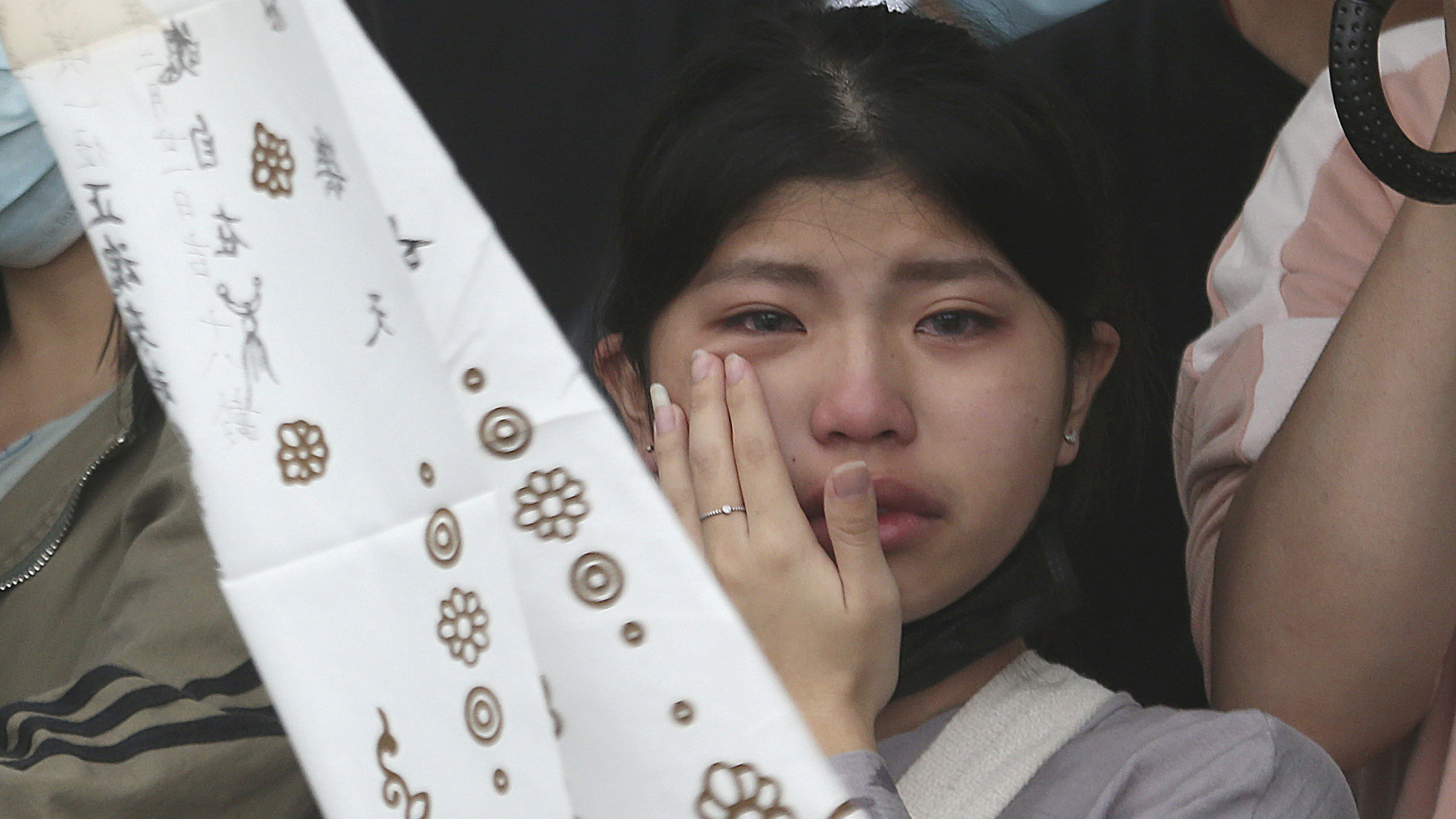 The families of the victims in a train crash cry as they mourn near Taroko Gorge in Hualien, Taiwan