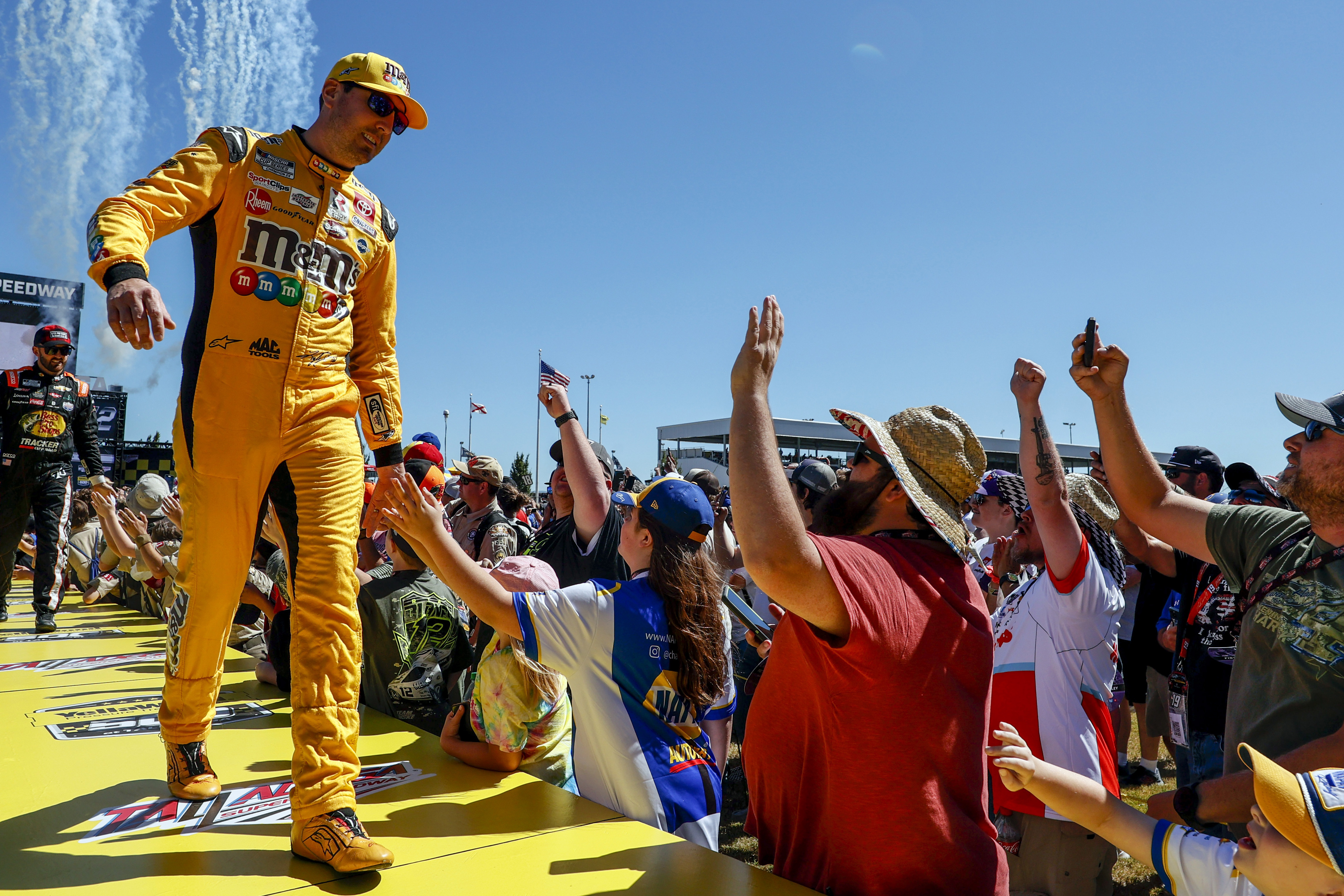 Kyle Busch greets fans before a NASCAR Cup Series race.