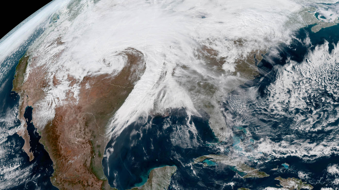 A handout picture made available by the National Oceanic and Atmospheric Administration (NOAA) winter storm Ulmer becoming a "bomb cyclone" over the central US.