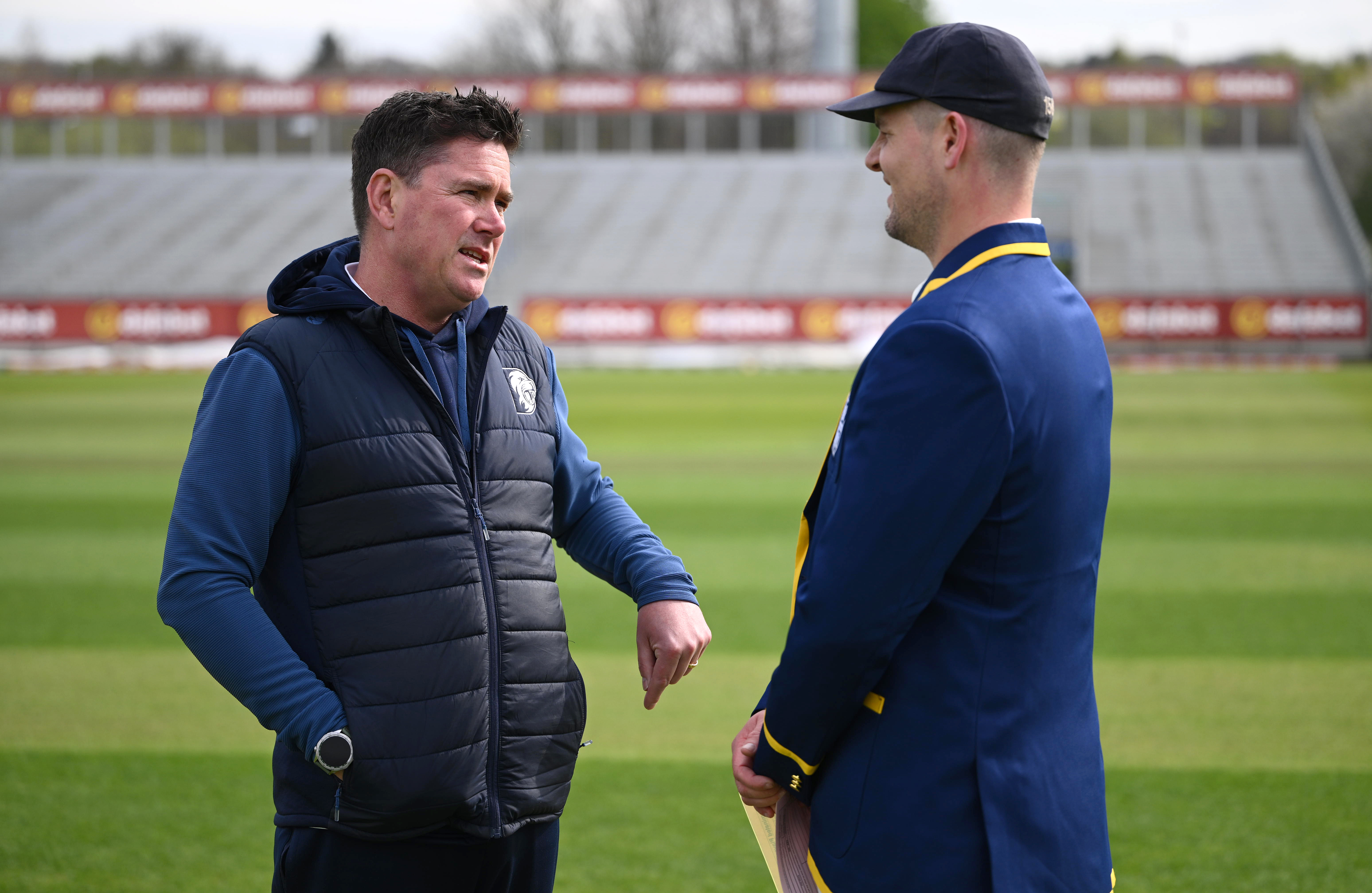 Durham captain Alex Lees in his blazer chats with Marcus North prior to day one of the Rothesay County Championship.