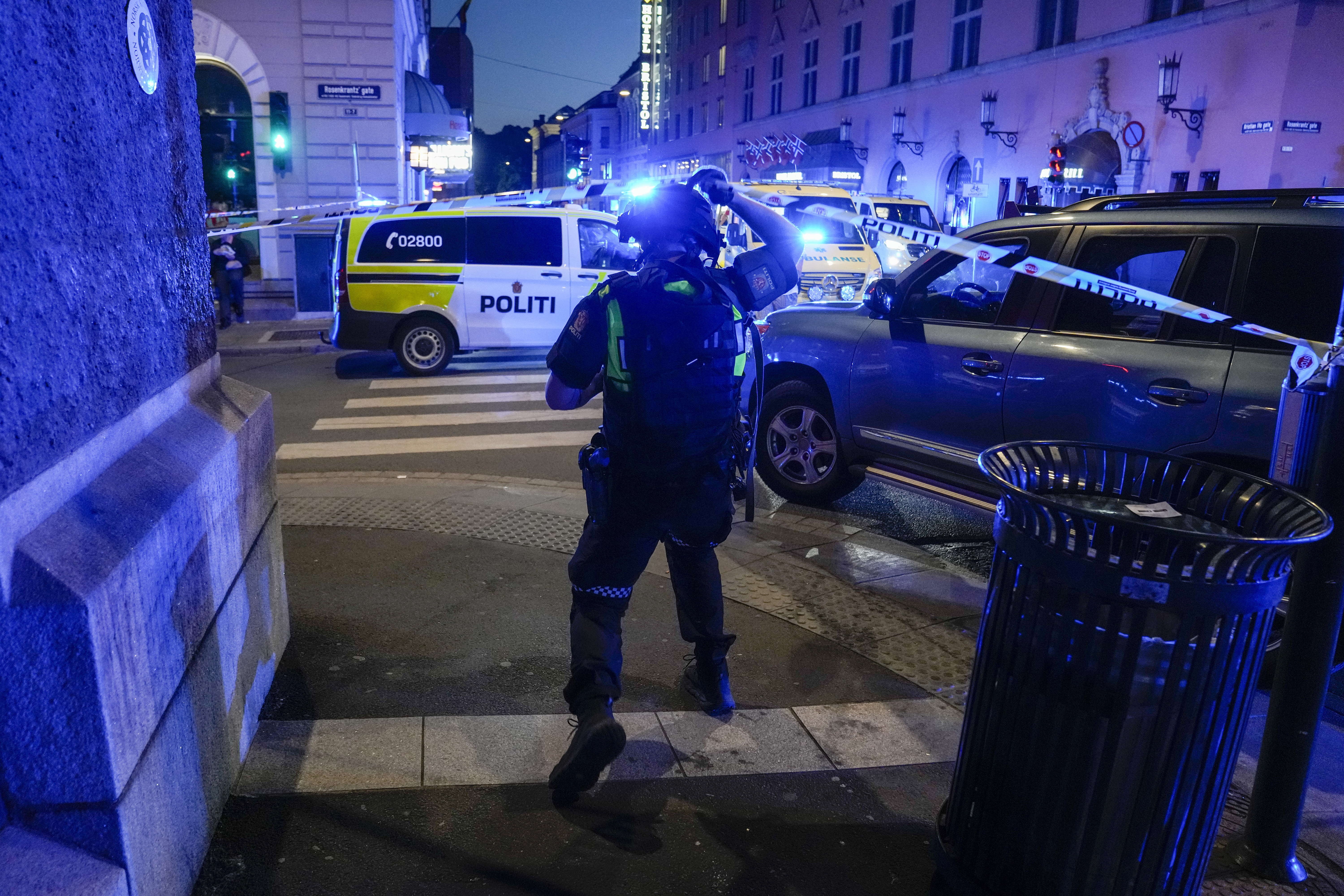 Police gather at the site of a mass shooting in Oslo, early Saturday, June 25, 2022. Norwegian police say a few people have been killed and more than a dozen injured in a mass shooting. (Javad Parsa/NTB via AP)