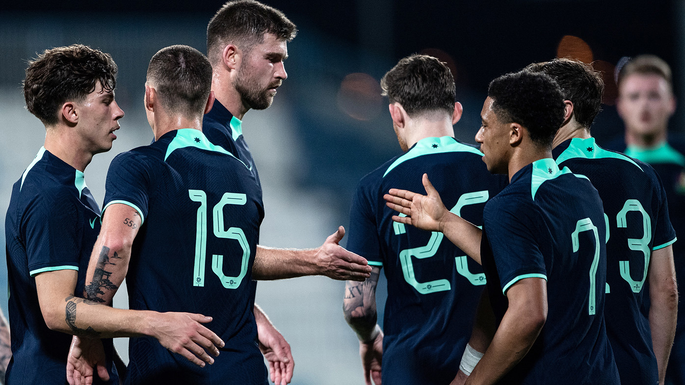 Australia's players celebrate an own goal by Bahrain in the international friendly on January 6, 2024 in Abu Dhabi, United Arab Emirates. (Photo by Martin Dokoupil/Getty Images)