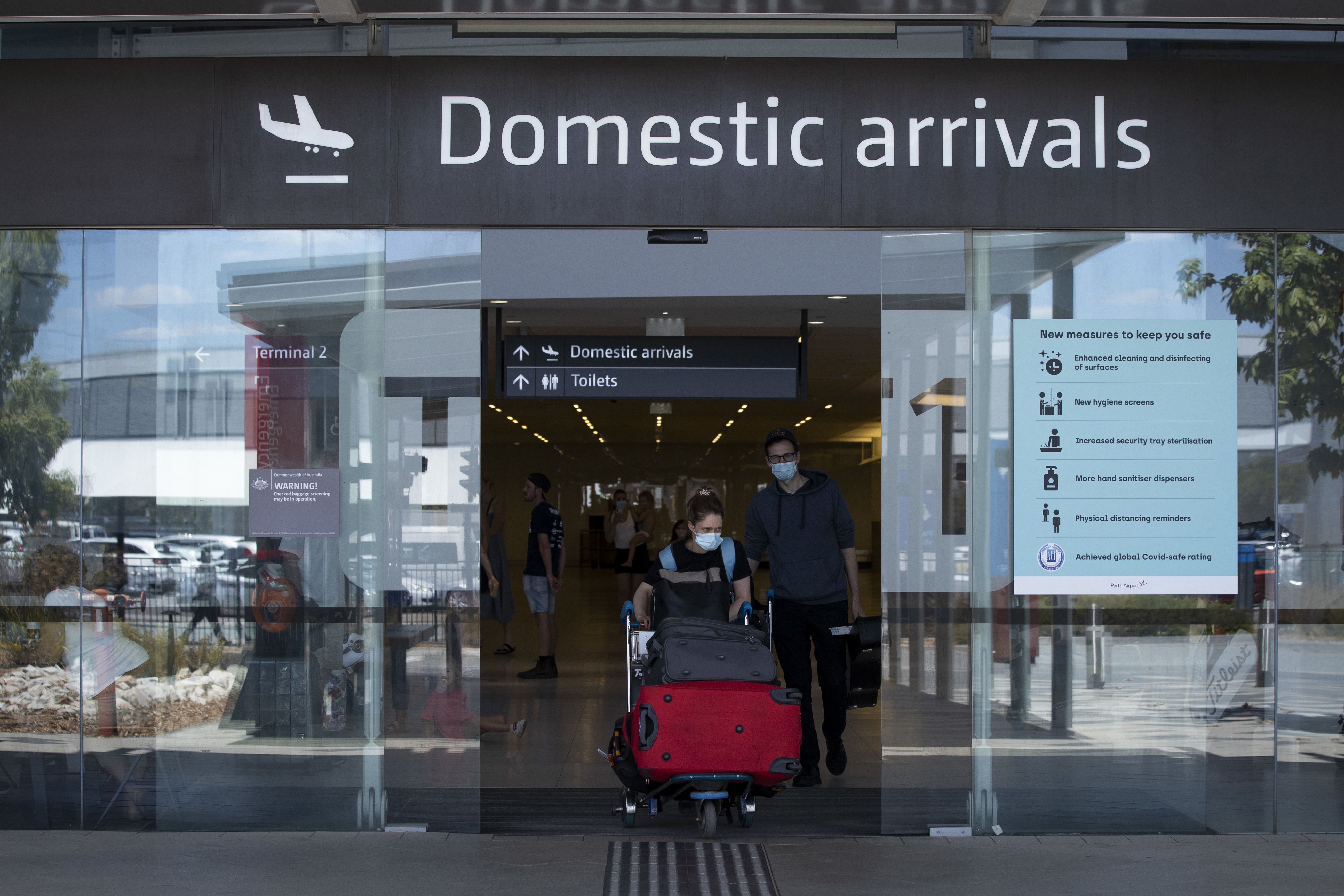 Man charged after allegedly spitting on police officer at Perth Airport