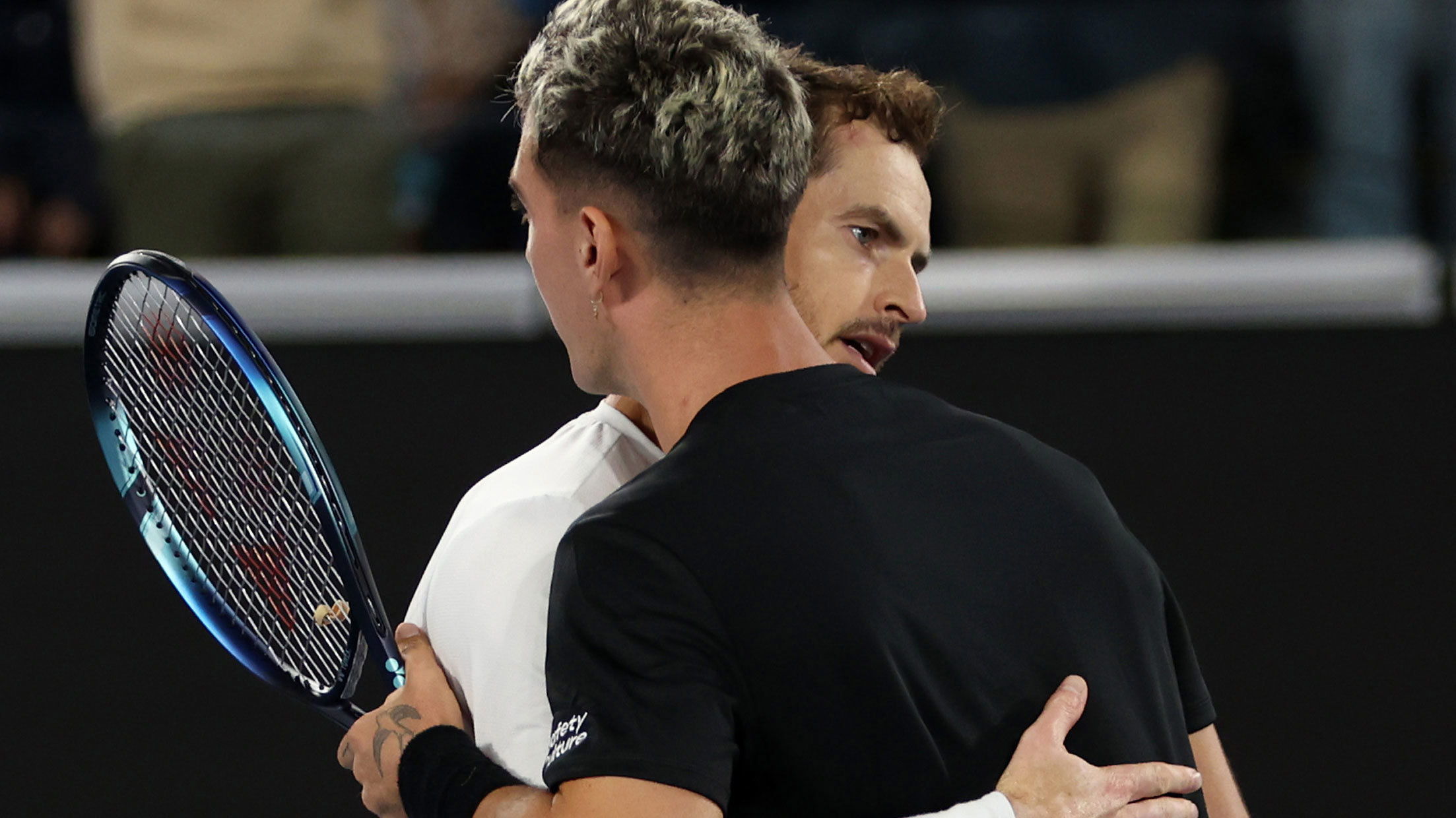MELBOURNE, AUSTRALIA - JANUARY 19:  Andy Murray of Great Britain shakes hands at the net after his five set victory in their round two singles match against Thanasi Kokkinakis of Australia during day four of the 2023 Australian Open at Melbourne Park on January 19, 2023 in Melbourne, Australia. (Photo by Clive Brunskill/Getty Images)