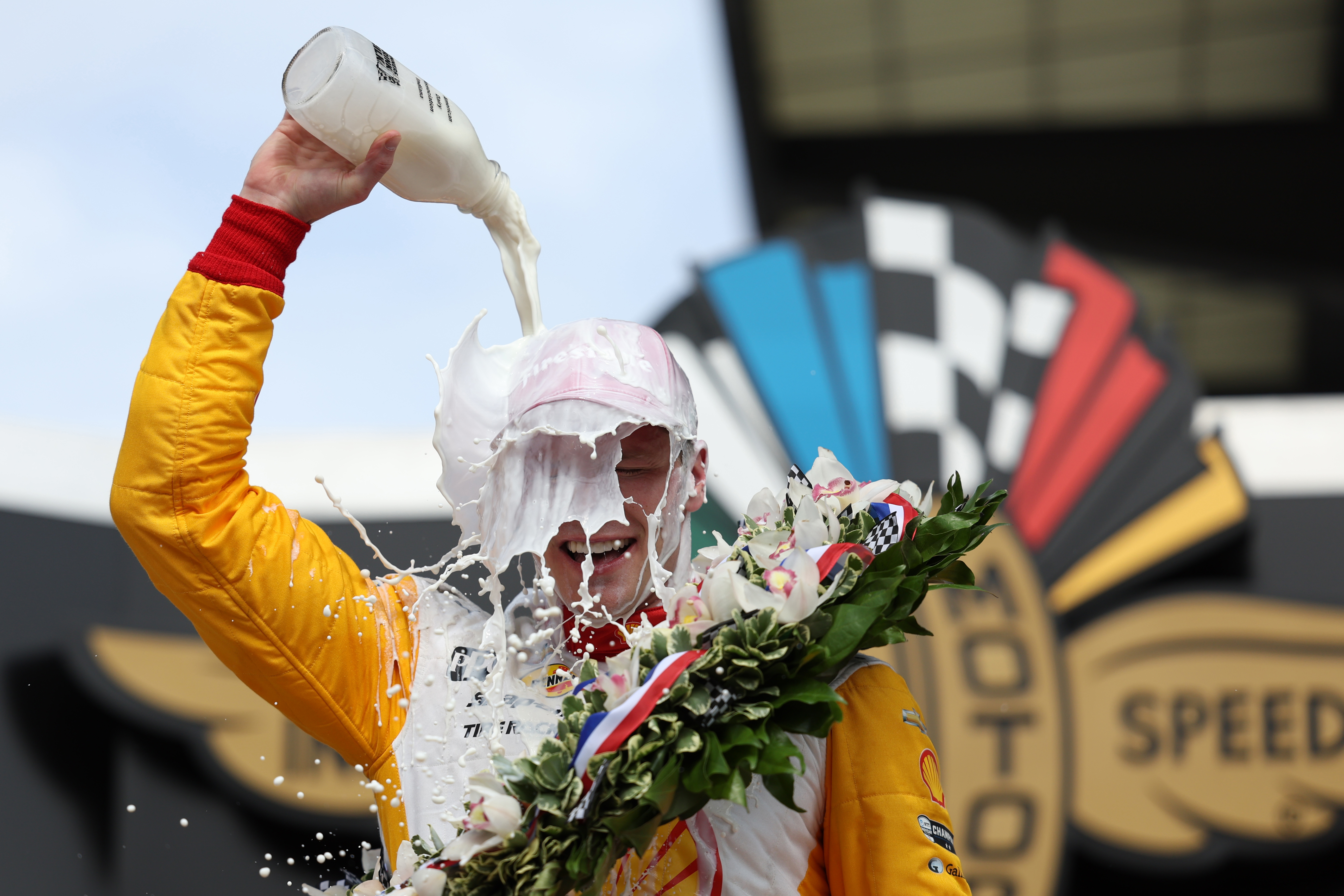 Josef Newgarden pours milk over his head after winning the 107th Indianapolis 500.