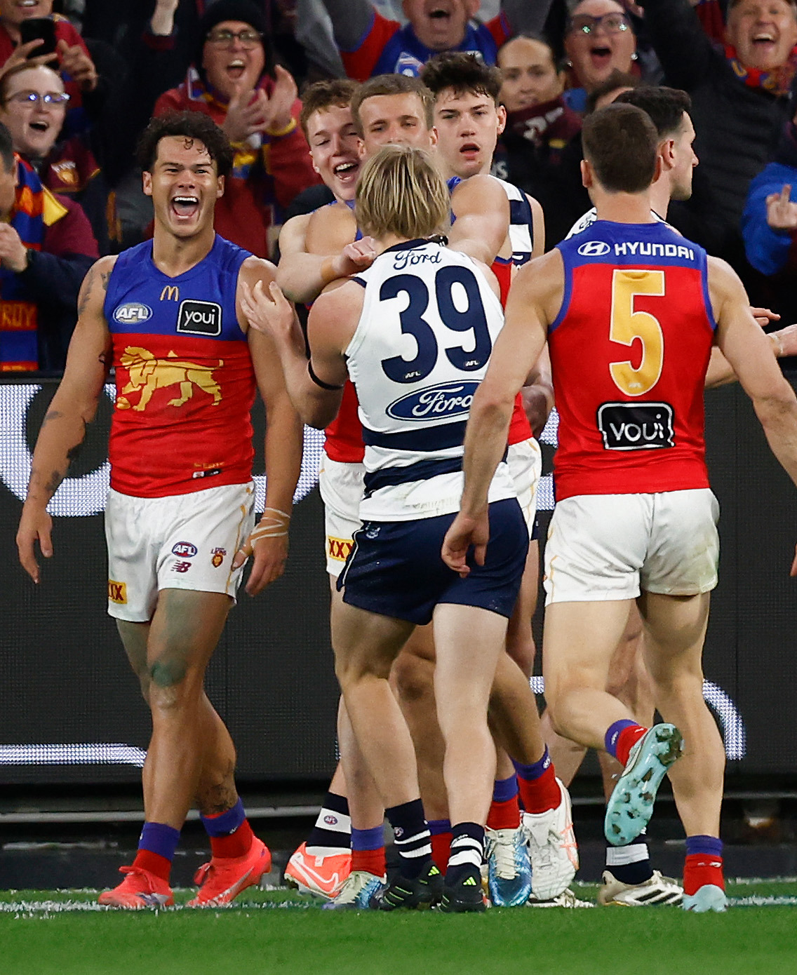  Cam Rayner of the Lions reacts after Zach Guthrie shoves him over.