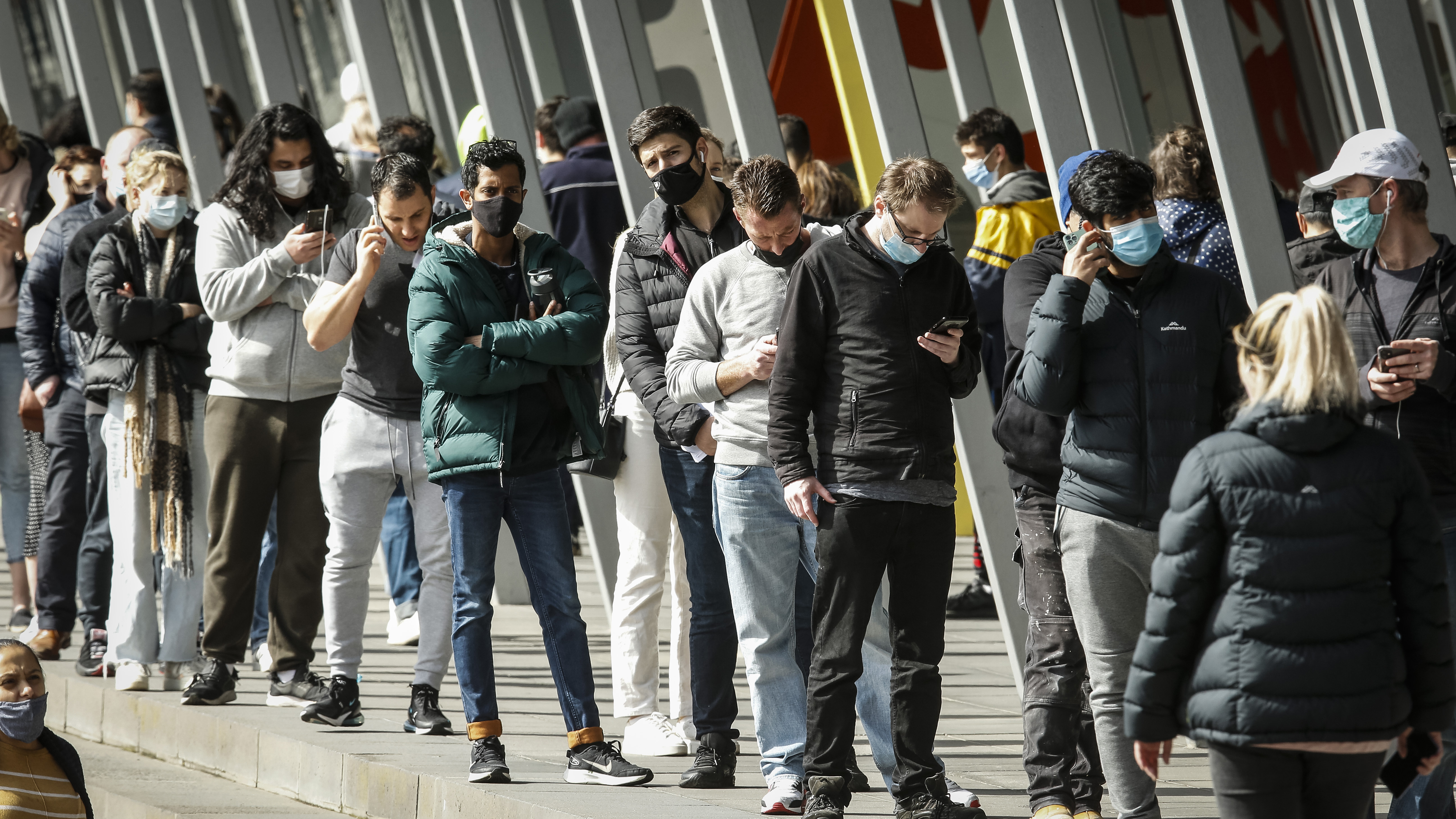 People lining up outside the Melbourne Exhibition Centre Vaccine Hub