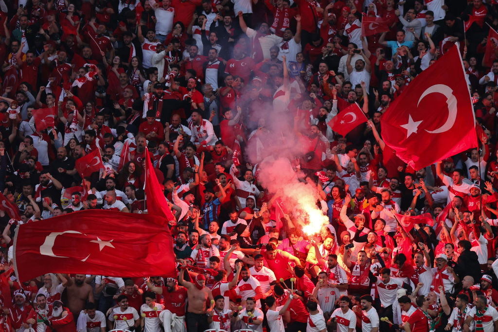 LEIPZIG, GERMANY - JULY 02: Fans of Turkey with red flares and flags during the UEFA EURO 2024 round of 16 match between Austria and Turkiye at Football Stadium Leipzig on July 02, 2024 in Leipzig, Germany. (Photo by James Baylis - AMA/Getty Images)