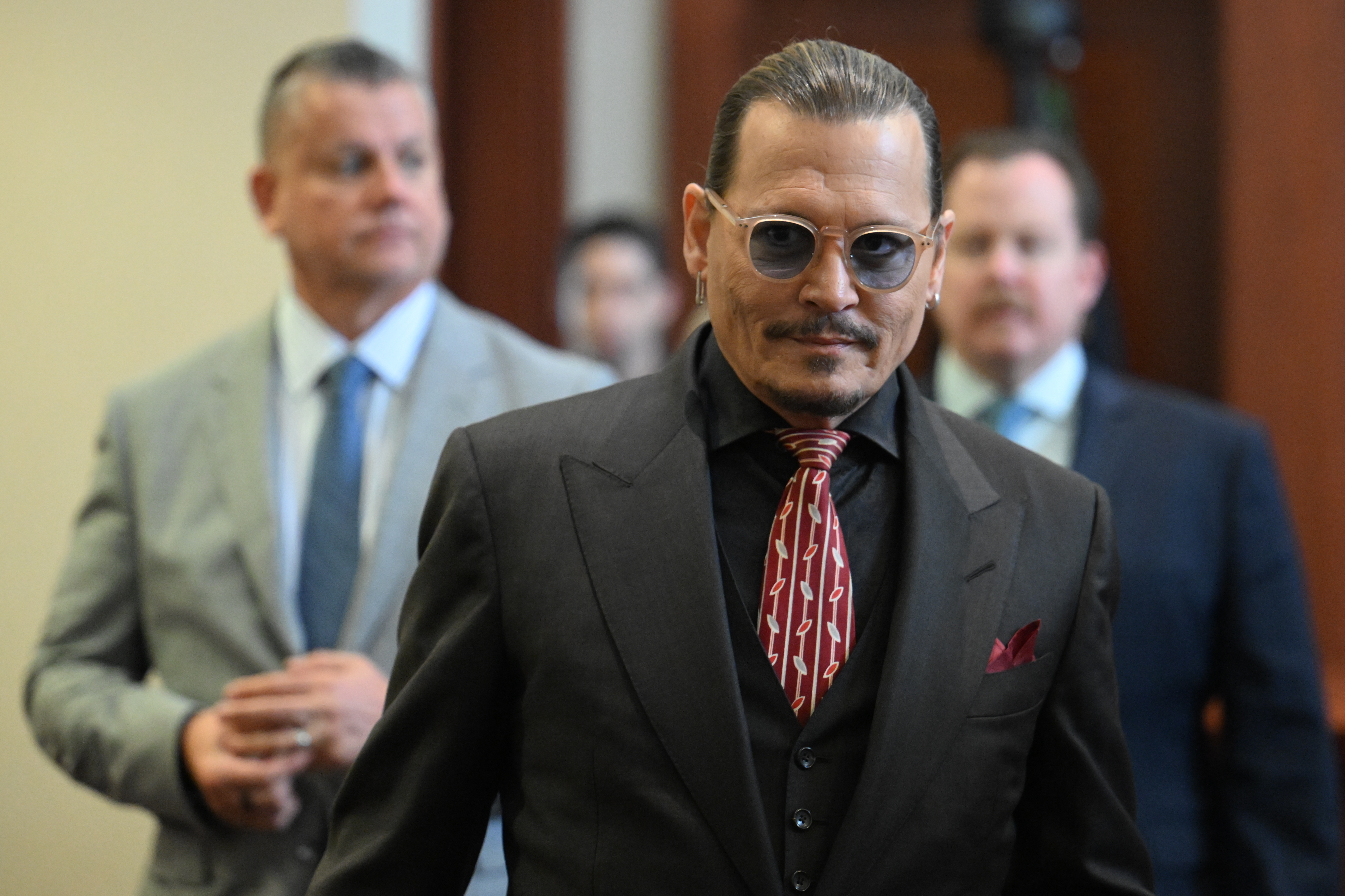 Actor Johnny Depp arrives in the courtroom at the Fairfax County Circuit Court in Fairfax, Va., Tuesday May 3, 2022.  