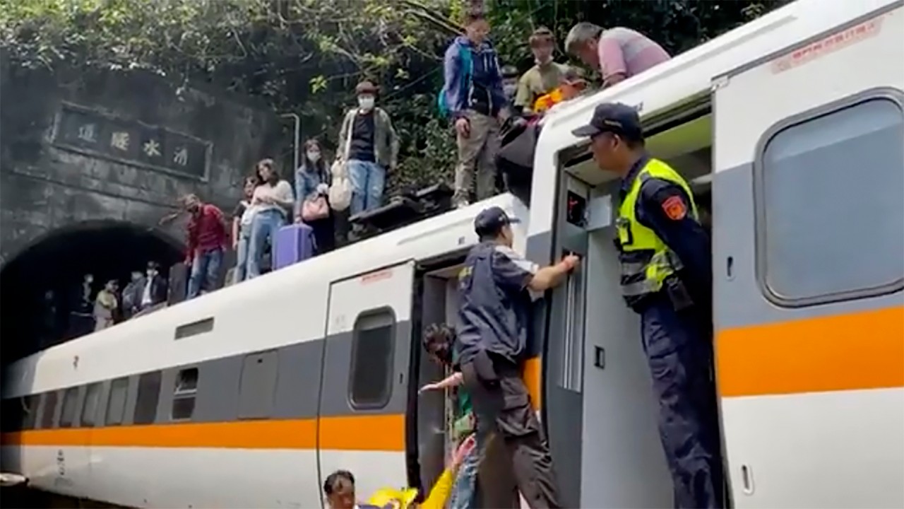 Passengers are assisted out of the train. The number of fatalities and injured was not immediately clear.