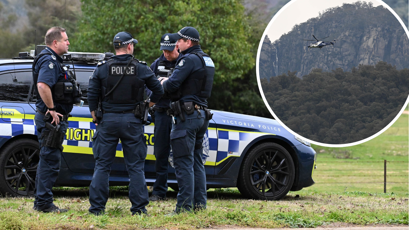 Manhunt for 'heavily armed' accused cop killer into second day