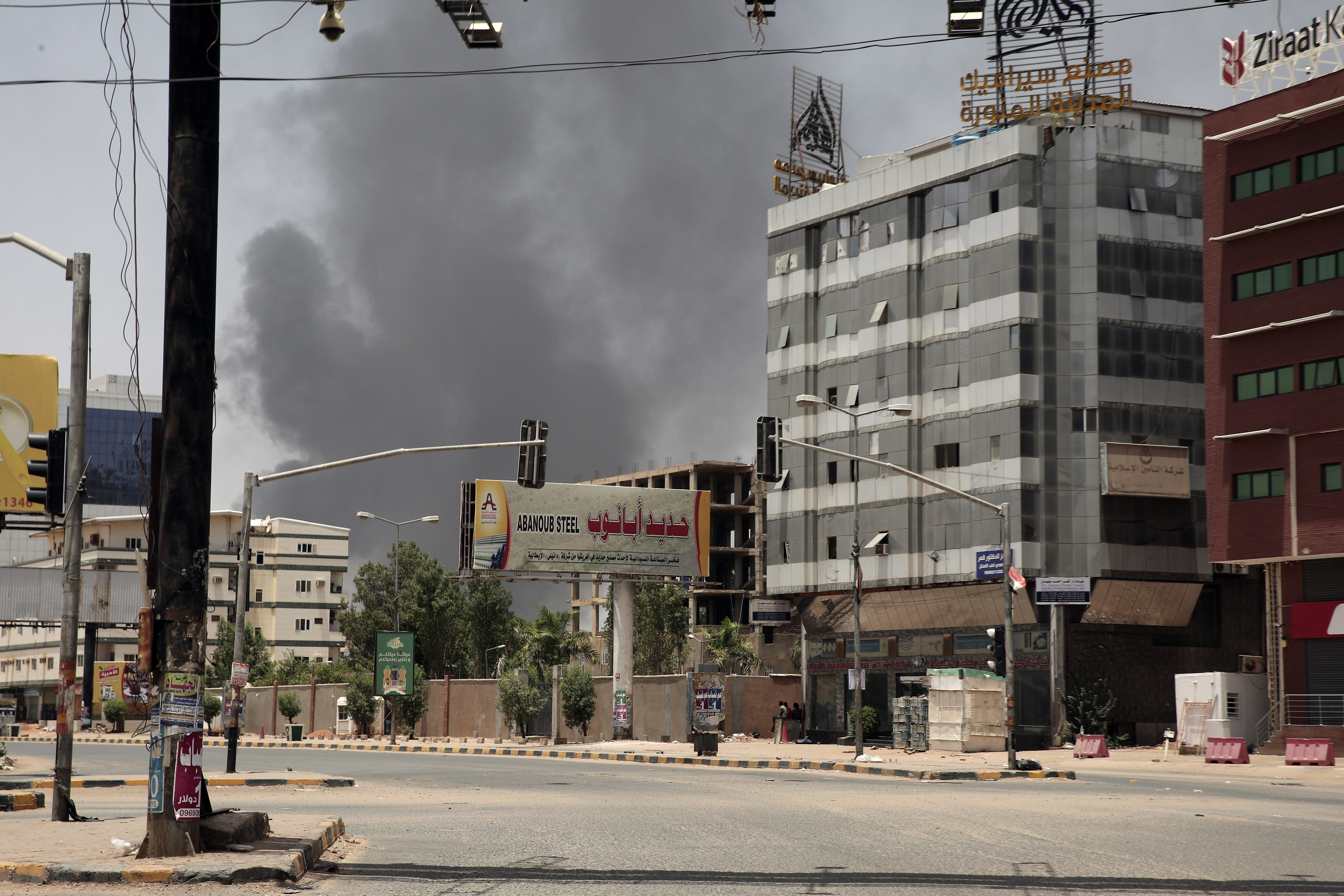 Smoke is seen rising from a neighborhood in Khartoum, Sudan, Saturday, April 15, 2023.  
