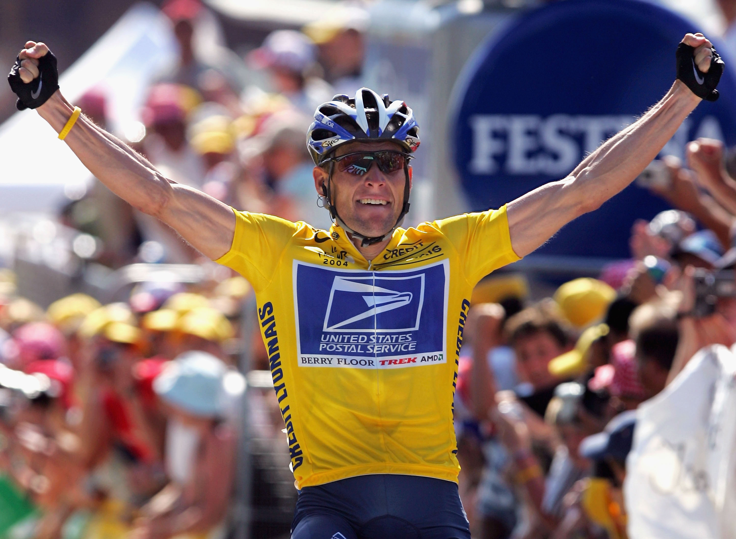 Lance Armstrong celebrates as he wins stage 17 of the Tour de France in 2004.