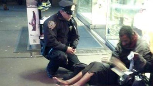 Jennifer Foster's photo of Officer Deprimo with the homeless man.